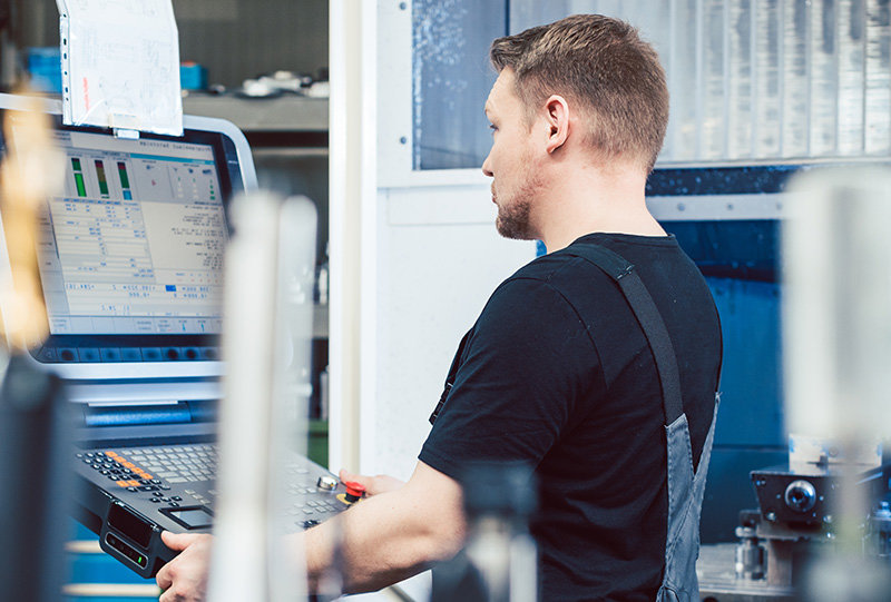 Men is working on Industrial Engraving Machines